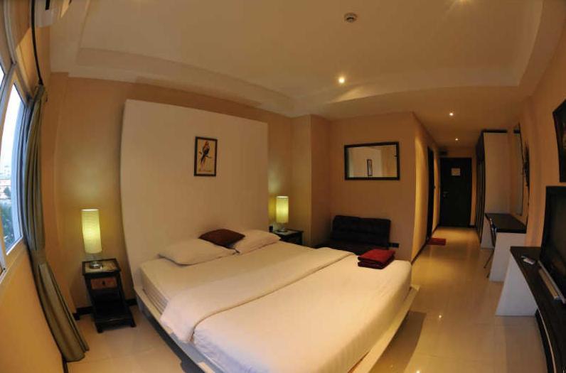 Le Parrots-Inn Praia de Jomtien Quarto foto